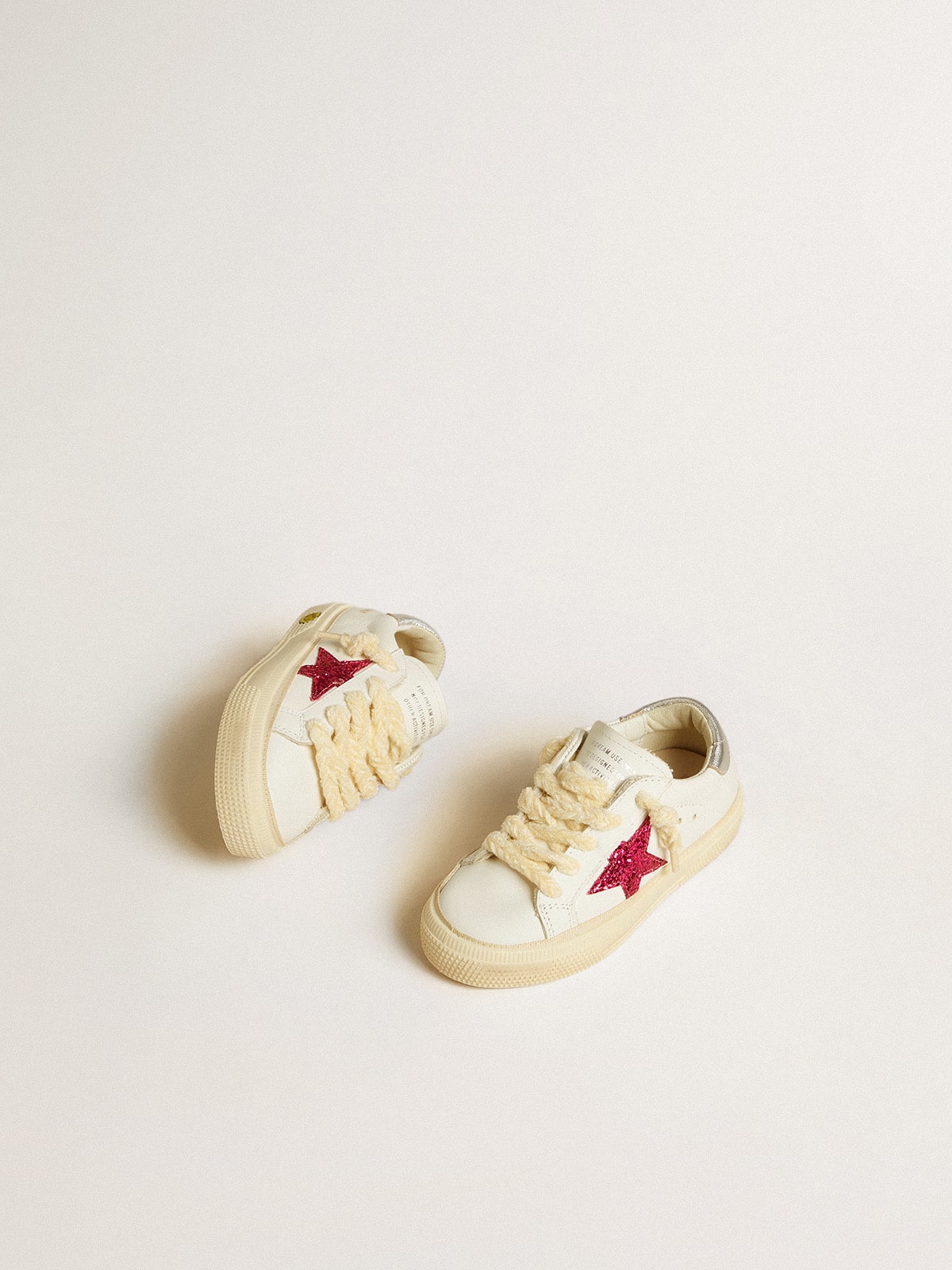 Junior May with fuchsia glitter star and metallic leather heel tab