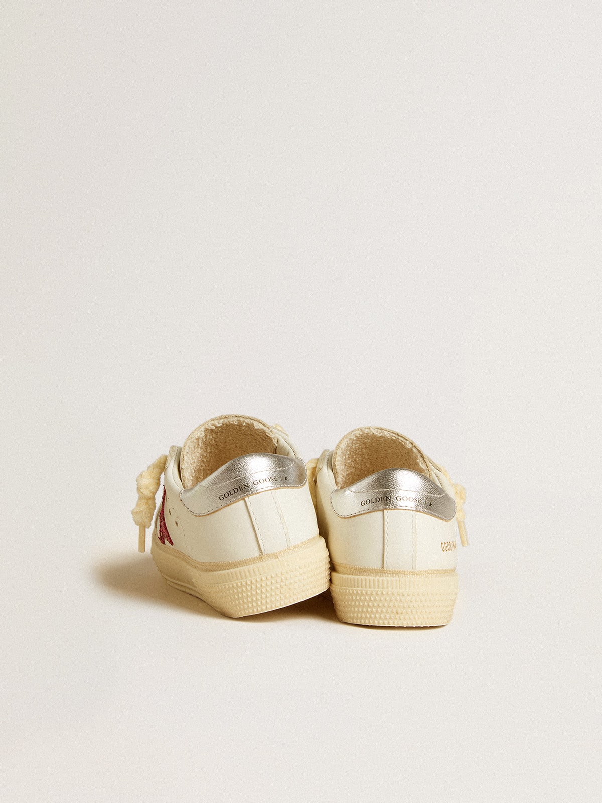 Junior May with fuchsia glitter star and metallic leather heel tab