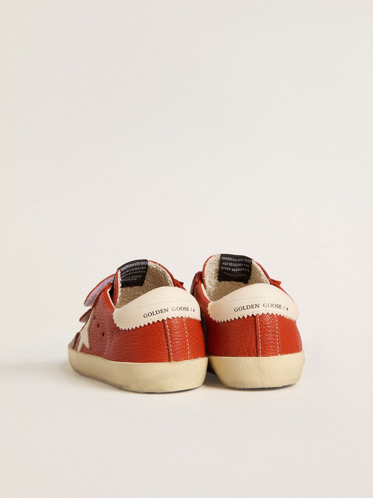 Junior Old School in orange nappa with white star and cream-colored leather heel tab