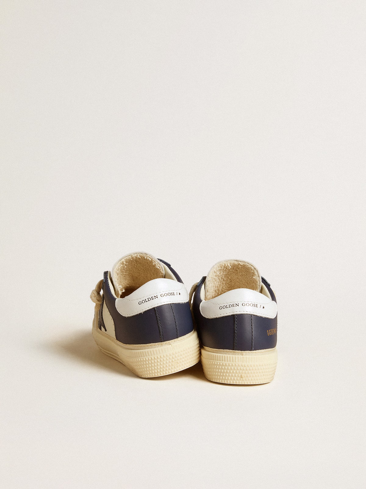 Junior May in white and blue leather with leather star and heel tab
