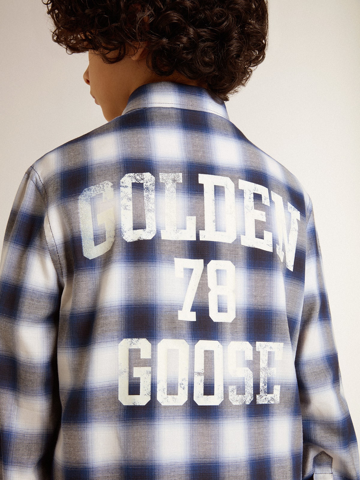 Boys' blue and white checked shirt with print on the back