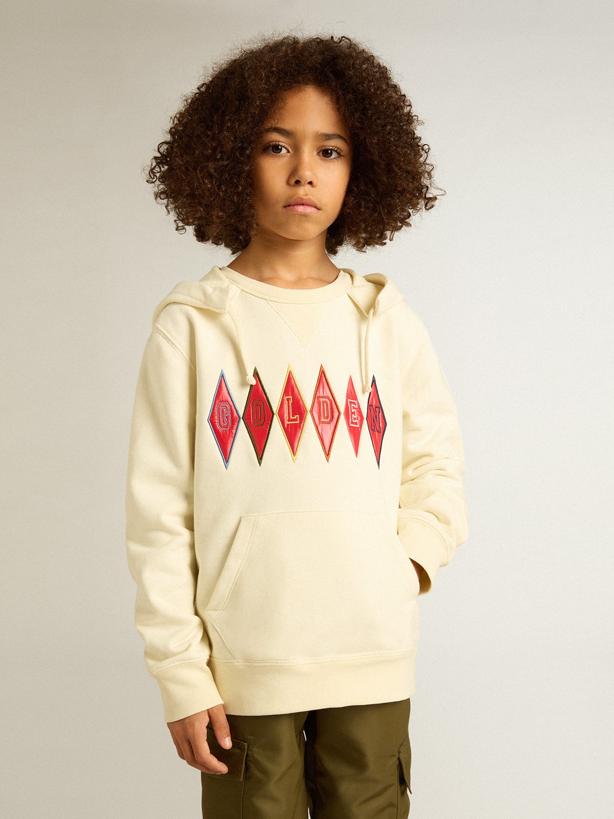 Hooded sweatshirt in worn white with Golden embroidery on the front