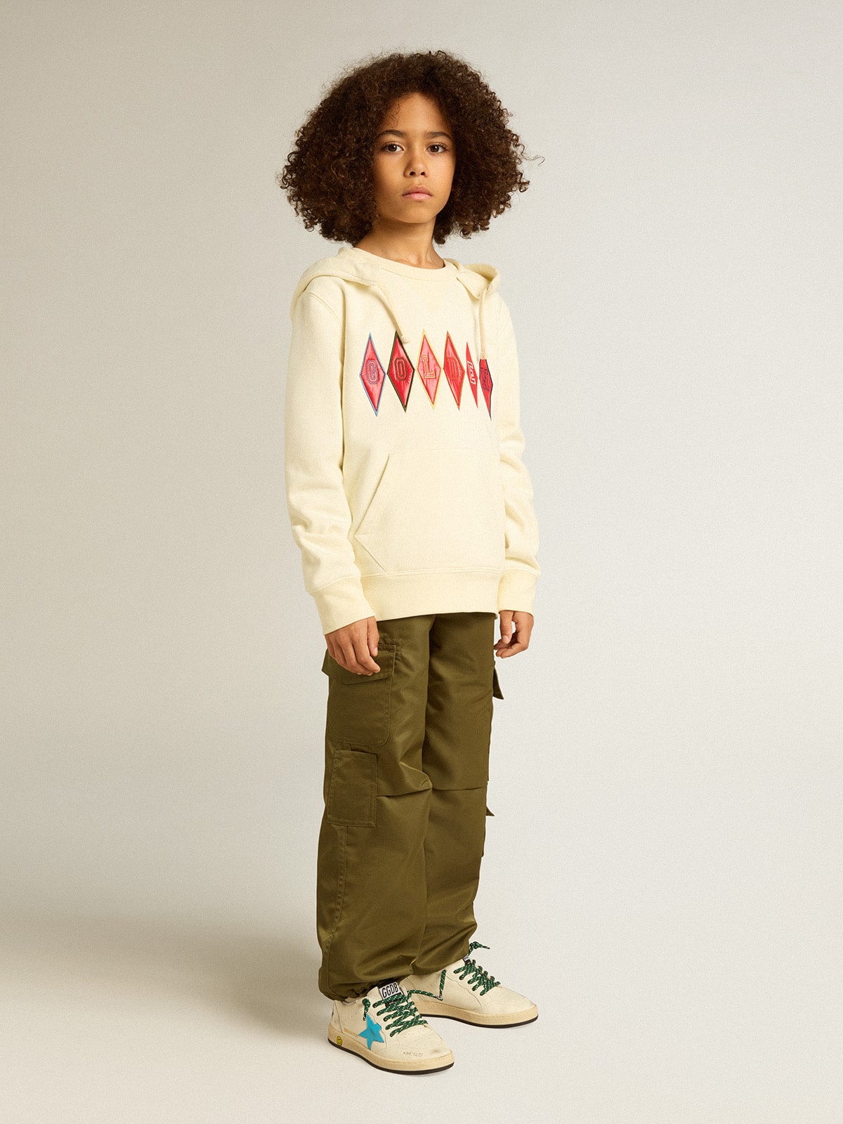 Hooded sweatshirt in worn white with Golden embroidery on the front