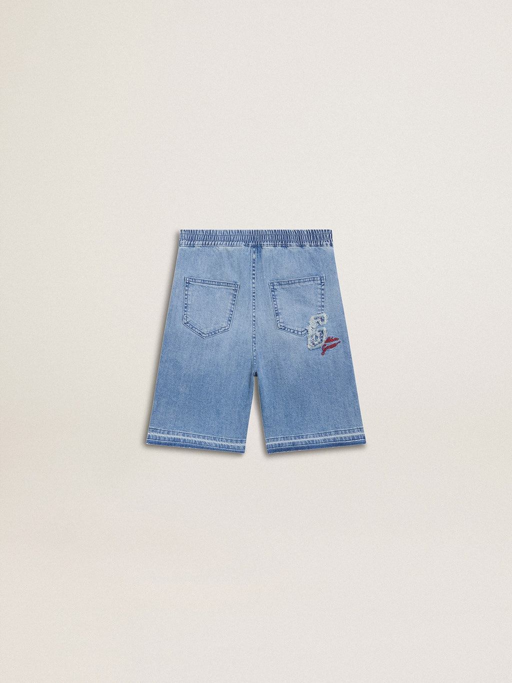 Kids’ denim shorts with embroidery on the back