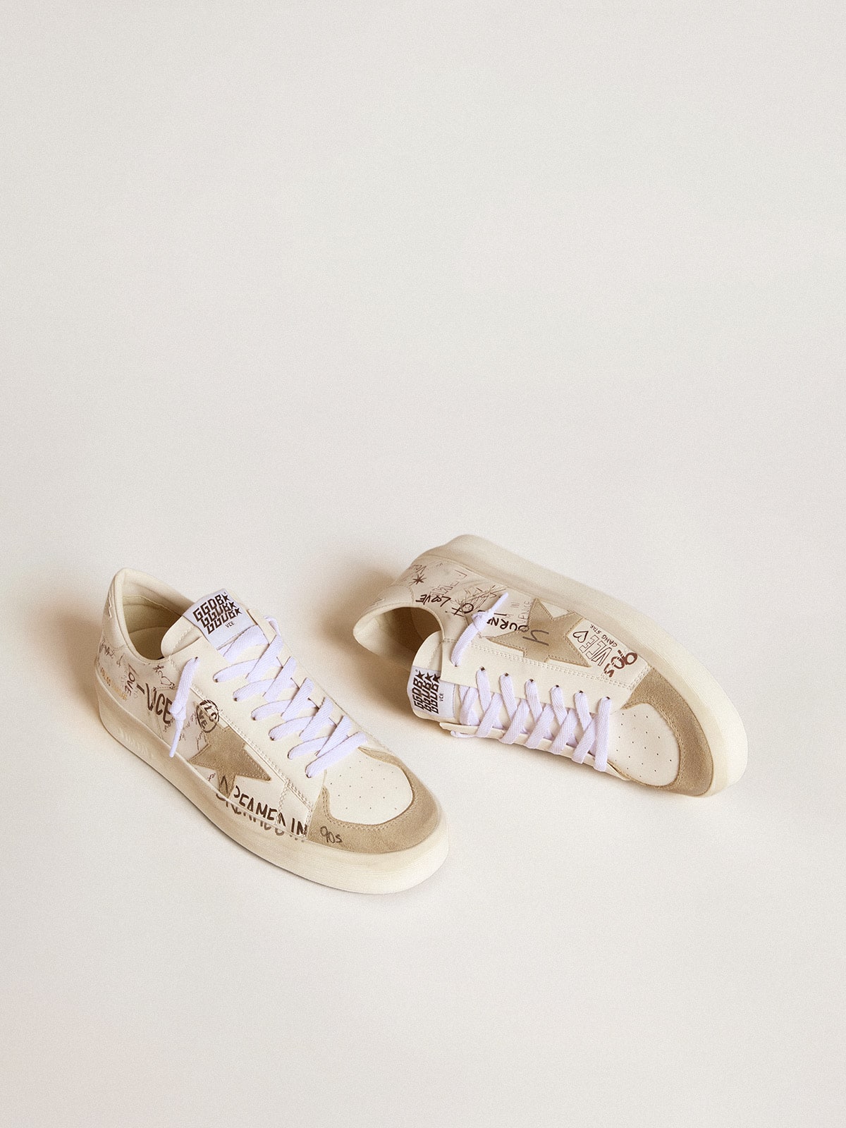 Stardan in leather with all-over lettering and ice-gray suede star