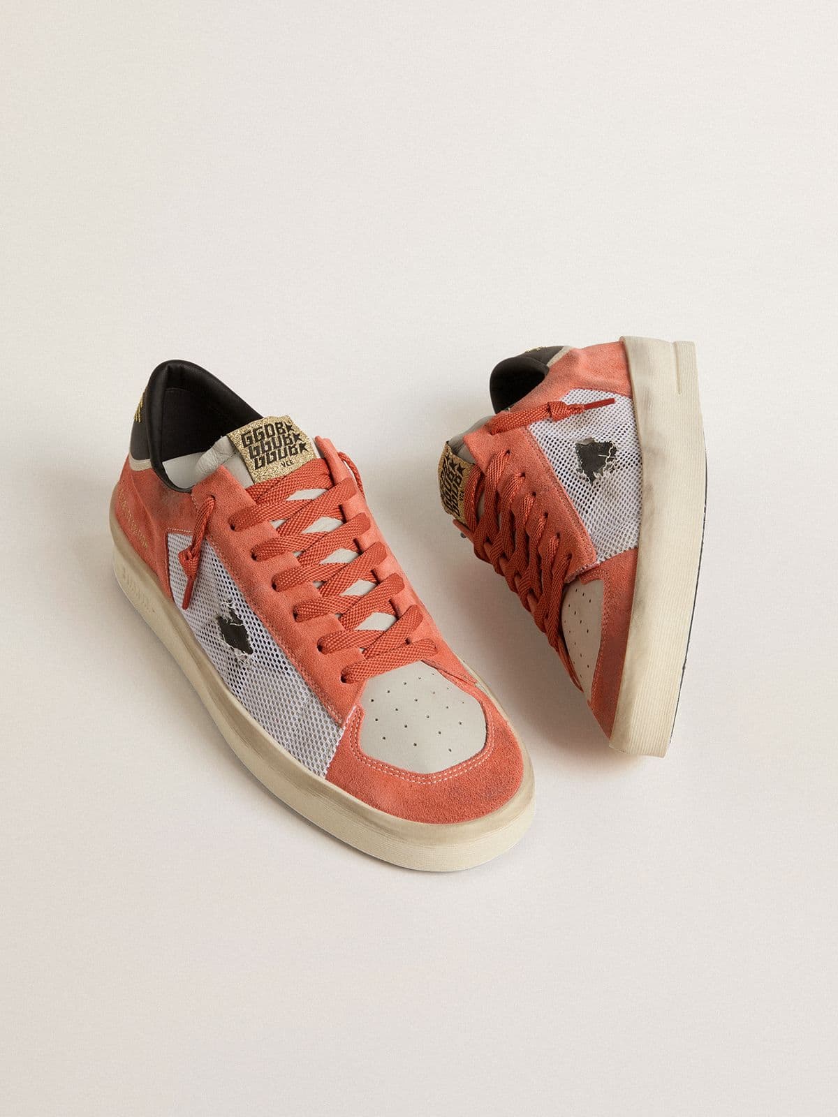 Stardan LTD in coral-colored suede and mesh with black leather star