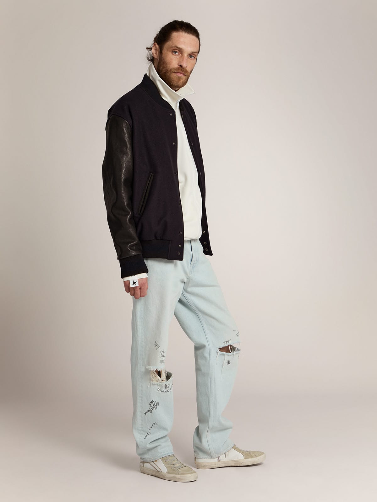 Men's bomber jacket in dark blue wool with leather sleeves