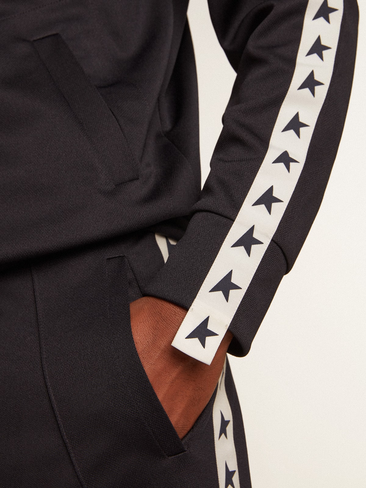 Dark blue sweatshirt with white strip and contrasting blue stars