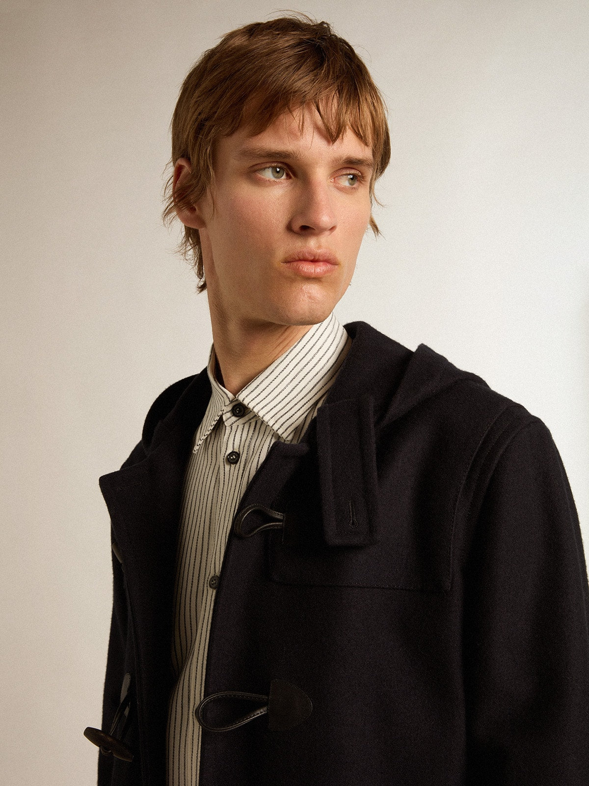 Dark blue wool duffle coat with hood and toggle fastening