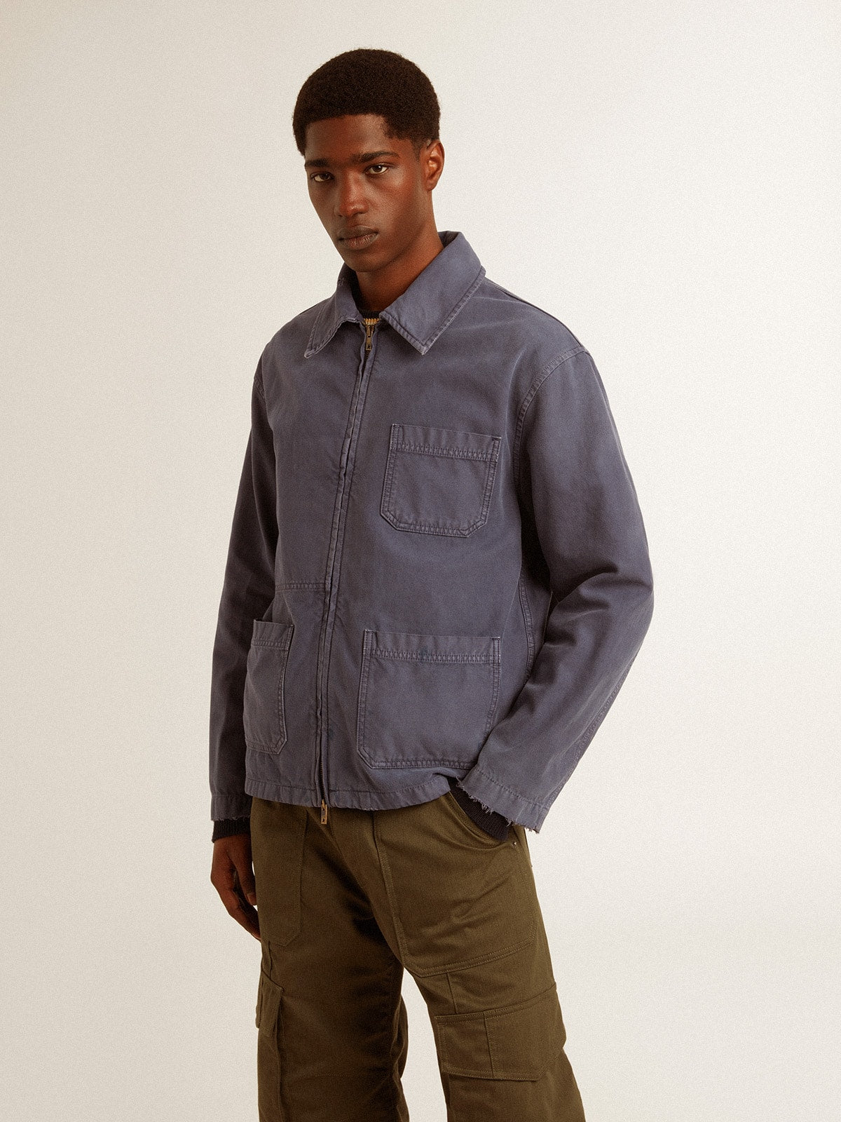 Men's blue jacket in denim cotton with distressed treatment