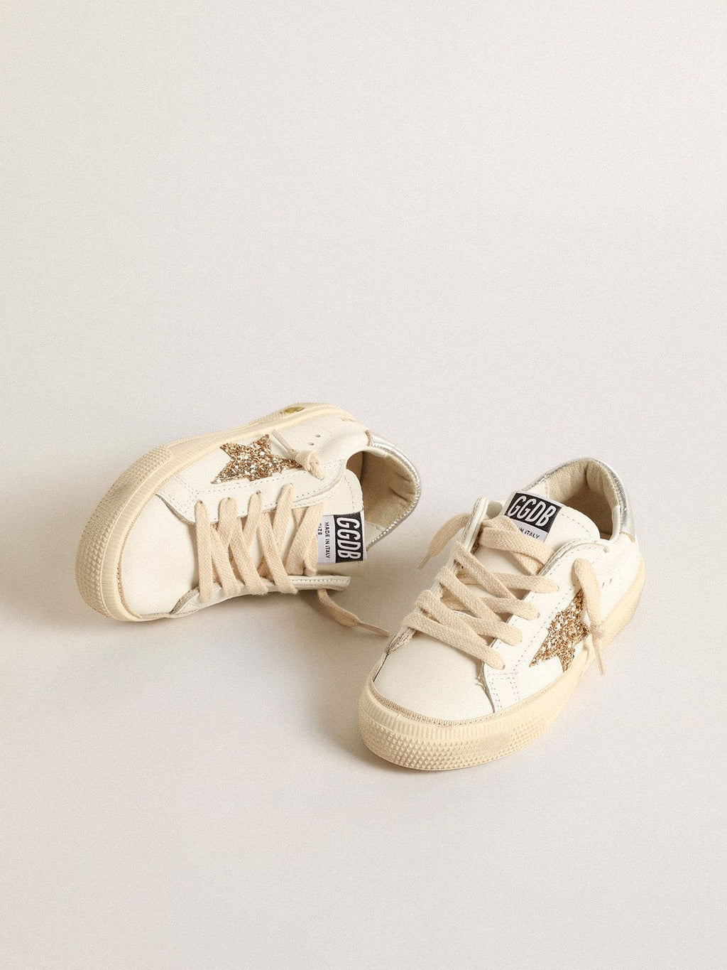 May Teen in white leather with gold glitter star and silver heel tab