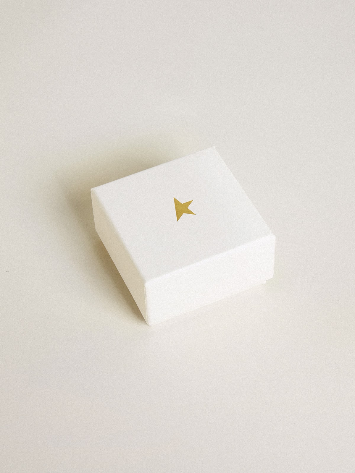 Letter F charm in gold-colored brass with crystals