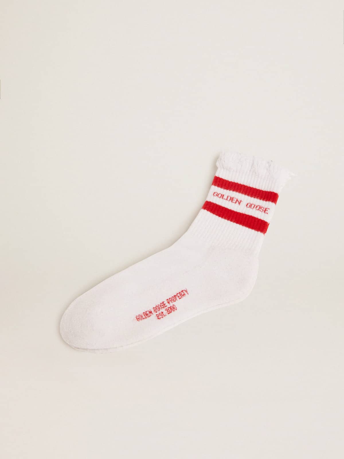 White socks with distressed details and red stripes