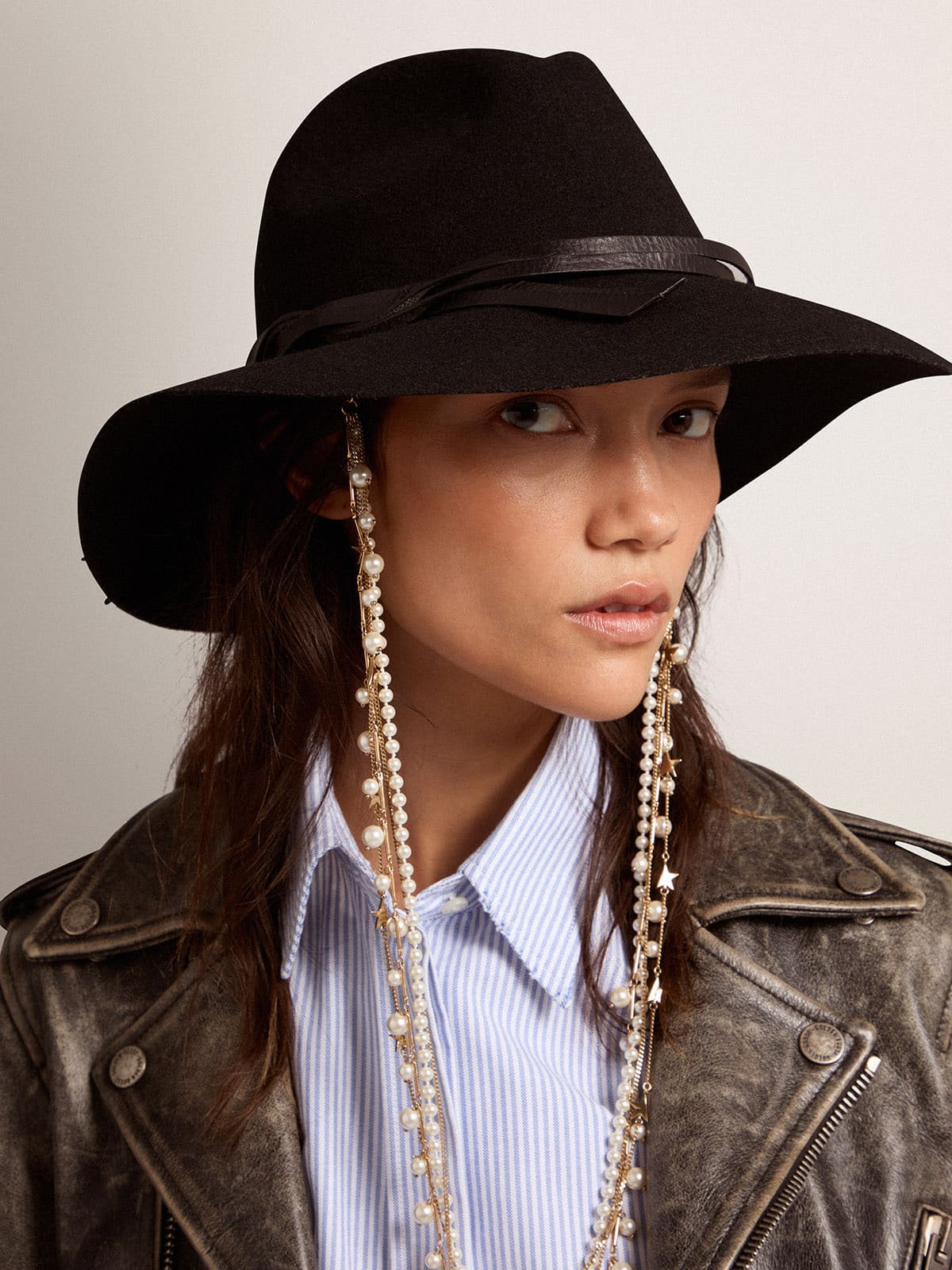 Black hat with leather strap