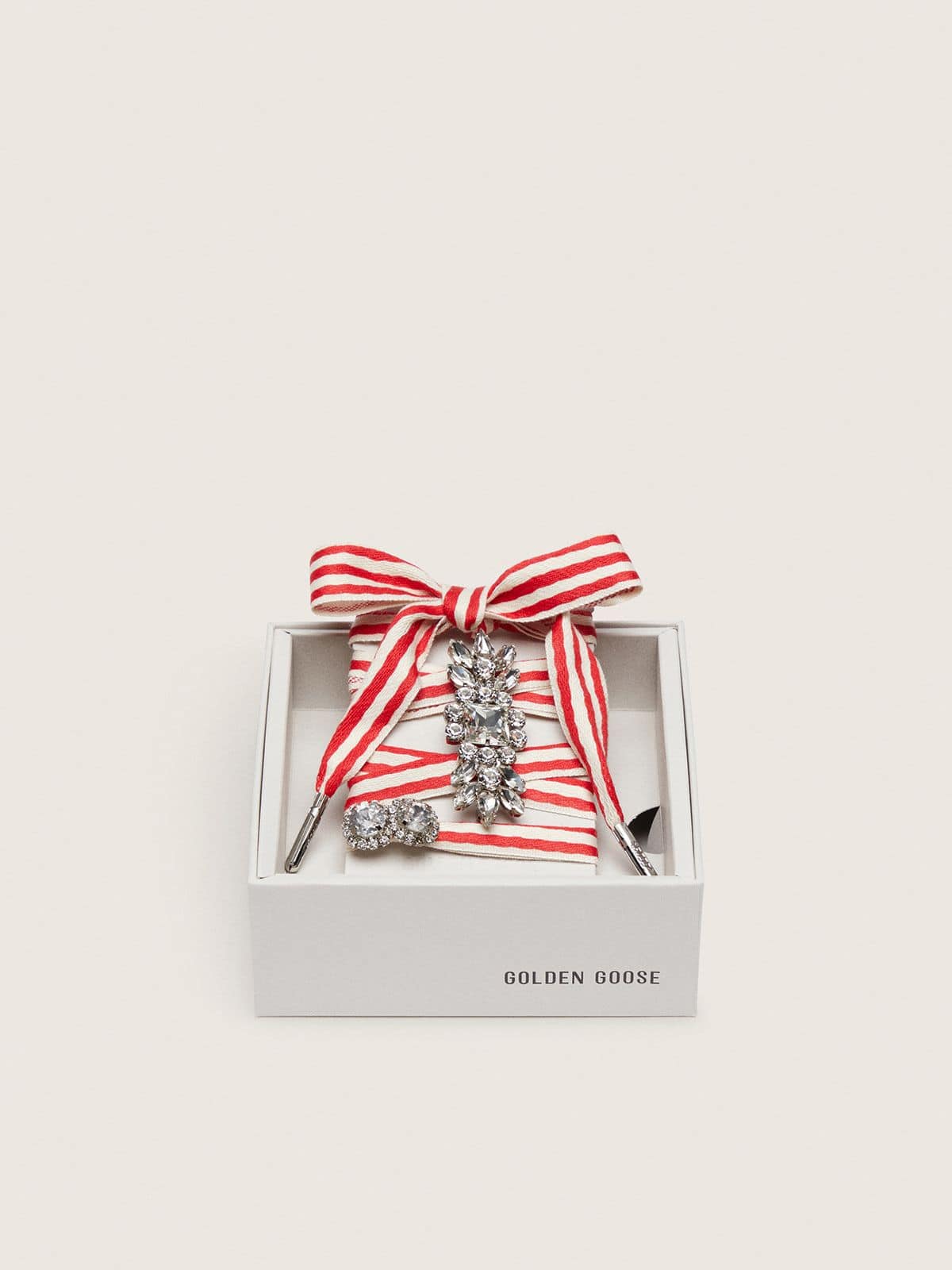 Skin "Playful" red and beige striped laces with two appliqué charms