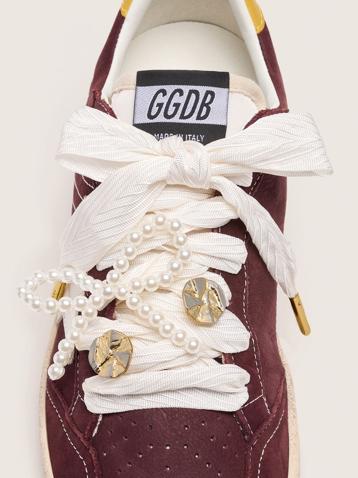 Skin "Sparkling" cream striped laces with appliqué beaded charm and golden charm