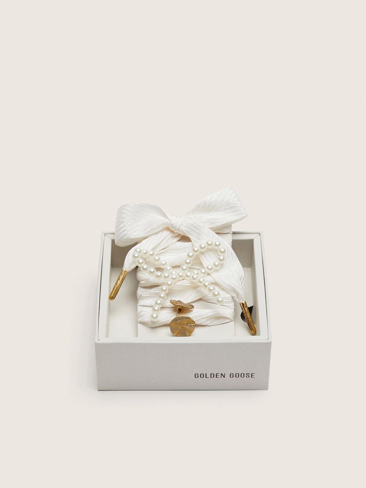 Skin "Sparkling" cream striped laces with appliqué beaded charm and golden charm