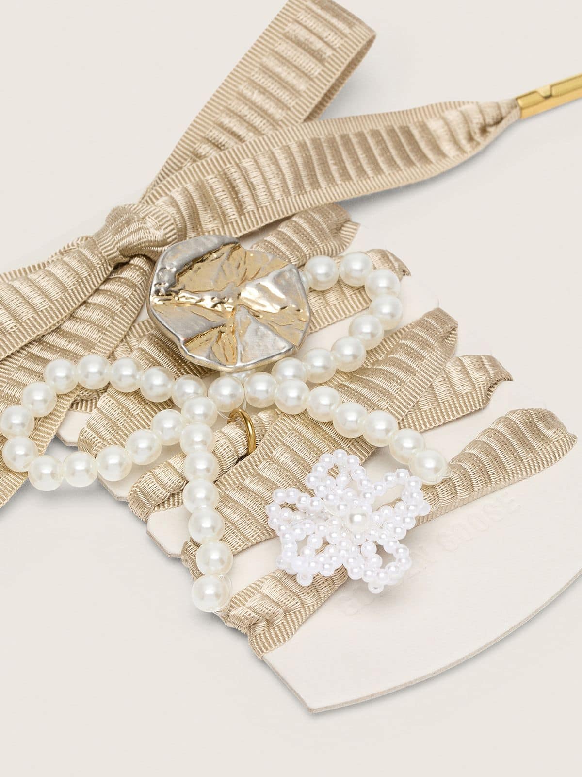 Skin "Sparkling" beige embroidered laces with appliqué beaded charms and gold charm