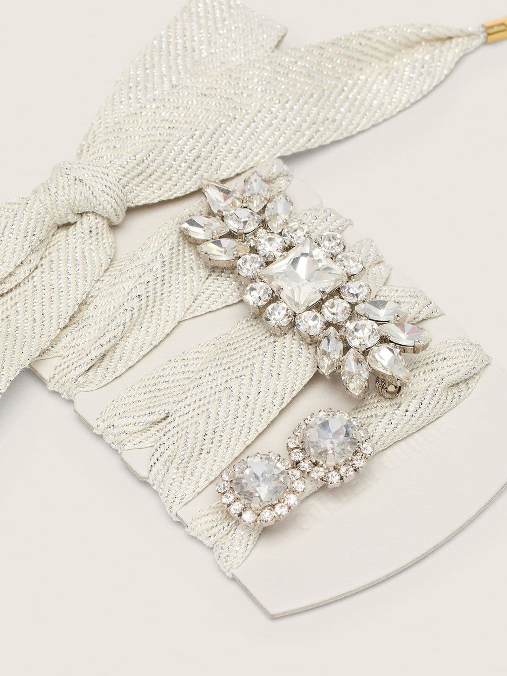Skin "Sparkling" cream and silver herringbone laces with two appliqué charms