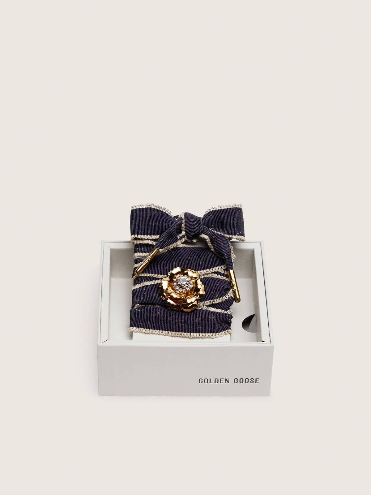 Skin "Sparkling" denim blue laces with beige trim and a golden charm