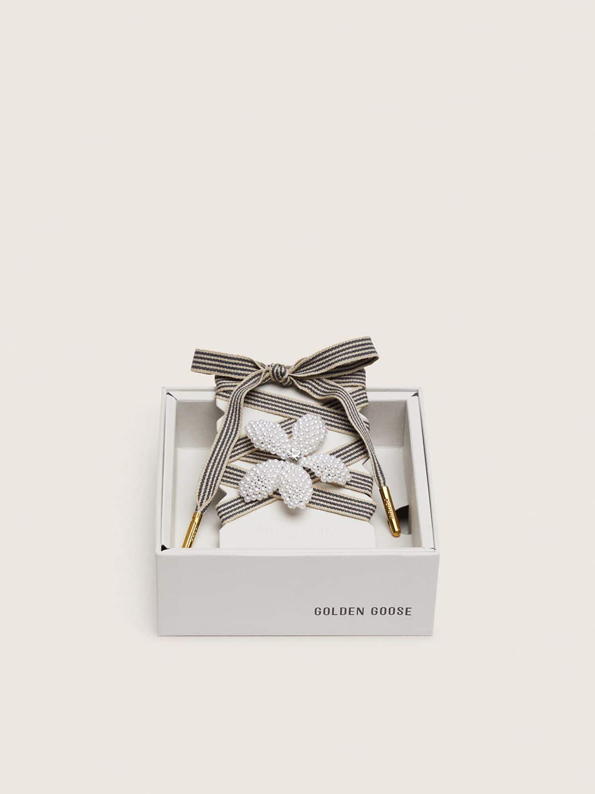 Skin "Vintage" black and beige striped laces with flower-shaped charm