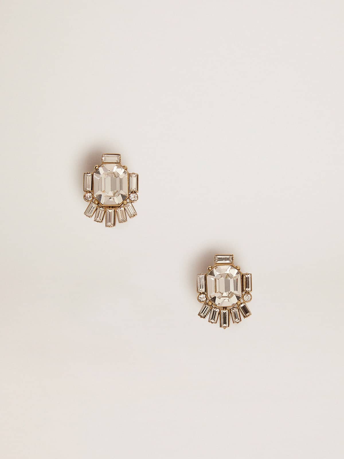 Women's Déco stud earrings in antique gold color with crystals