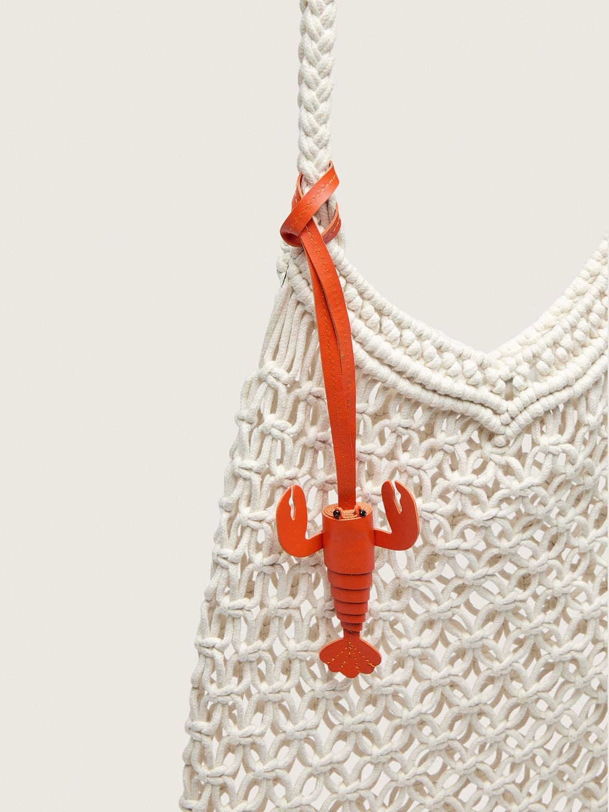 Women's macramé bag in butter-colored cotton with a leather lobster charm