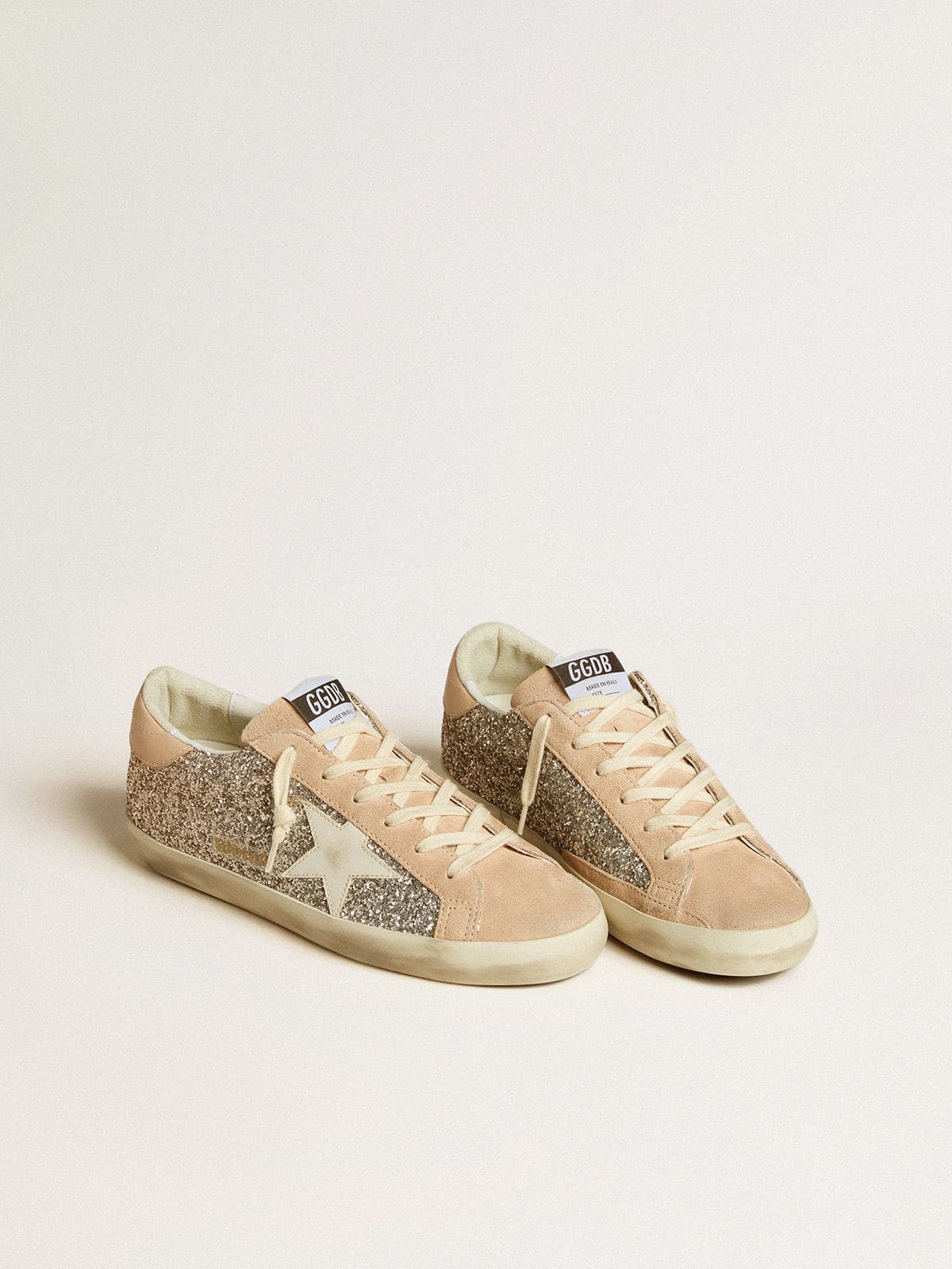 Women’s Super-Star in silver glitter with leather star and heel tab