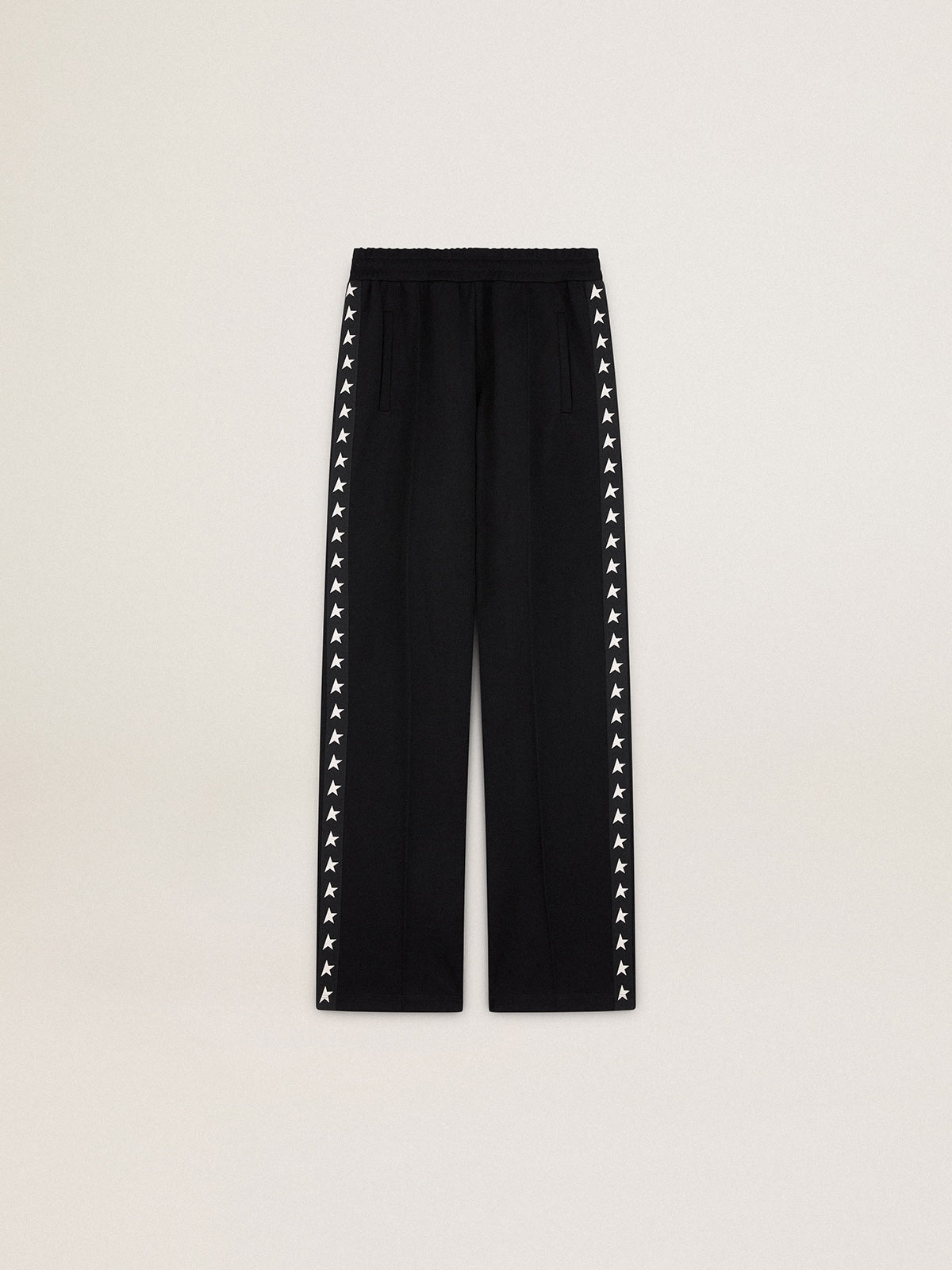 Women’s black joggers with white stars on the sides