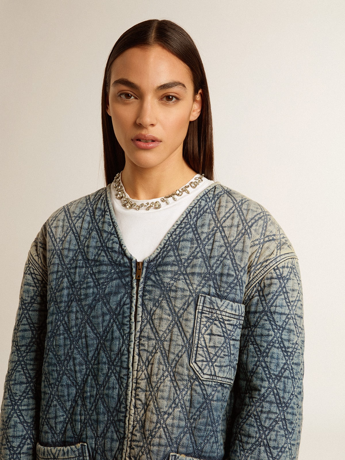 Women's blue quilted jacket in cotton denim with distressed finish