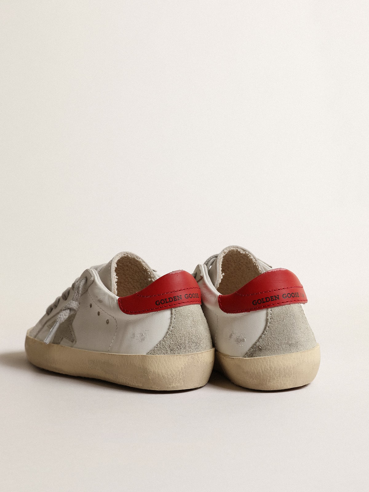 Super-Star Young with suede star and red leather heel tab