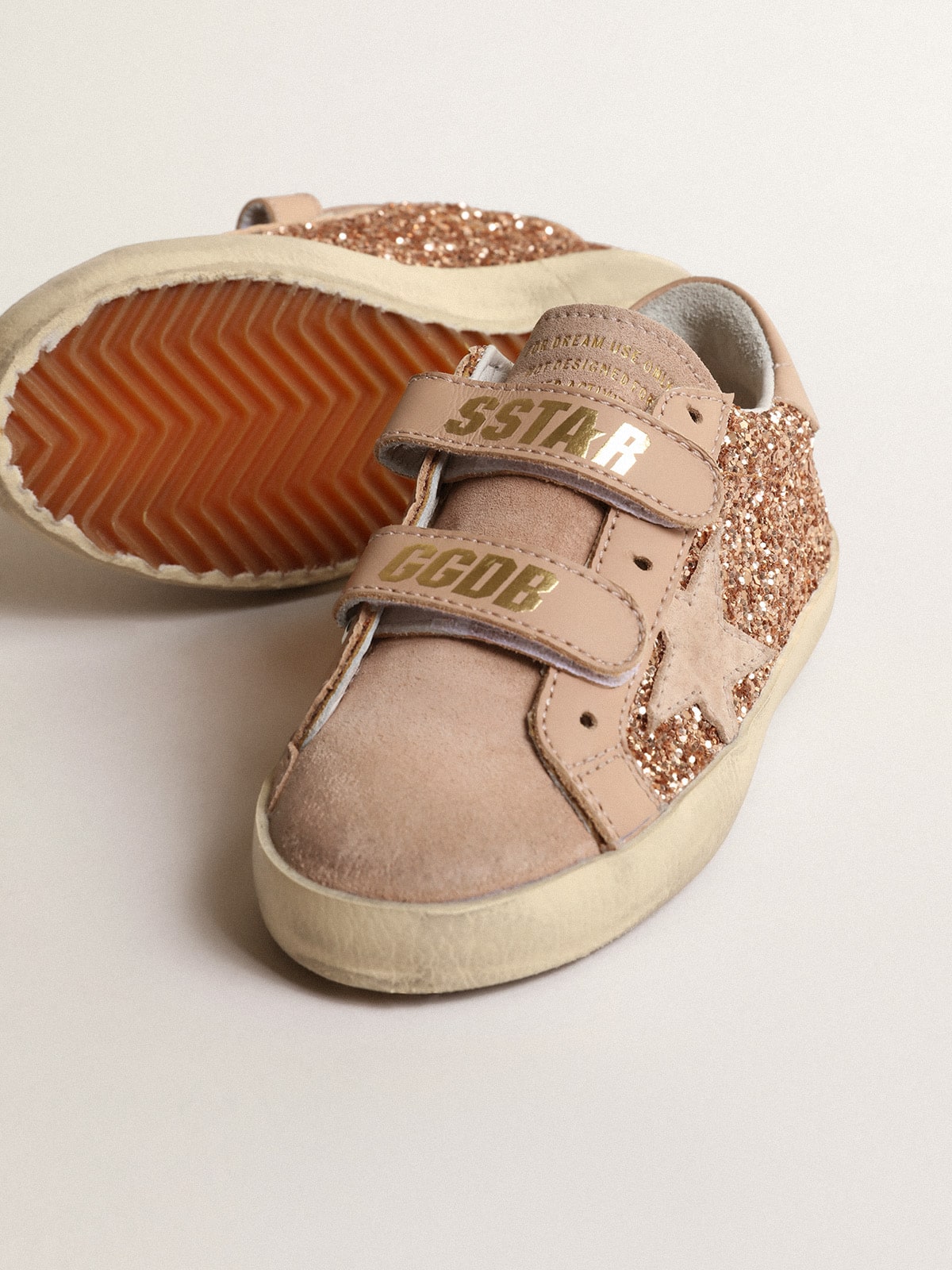 Old School Young in peach-pink glitter with pink suede star