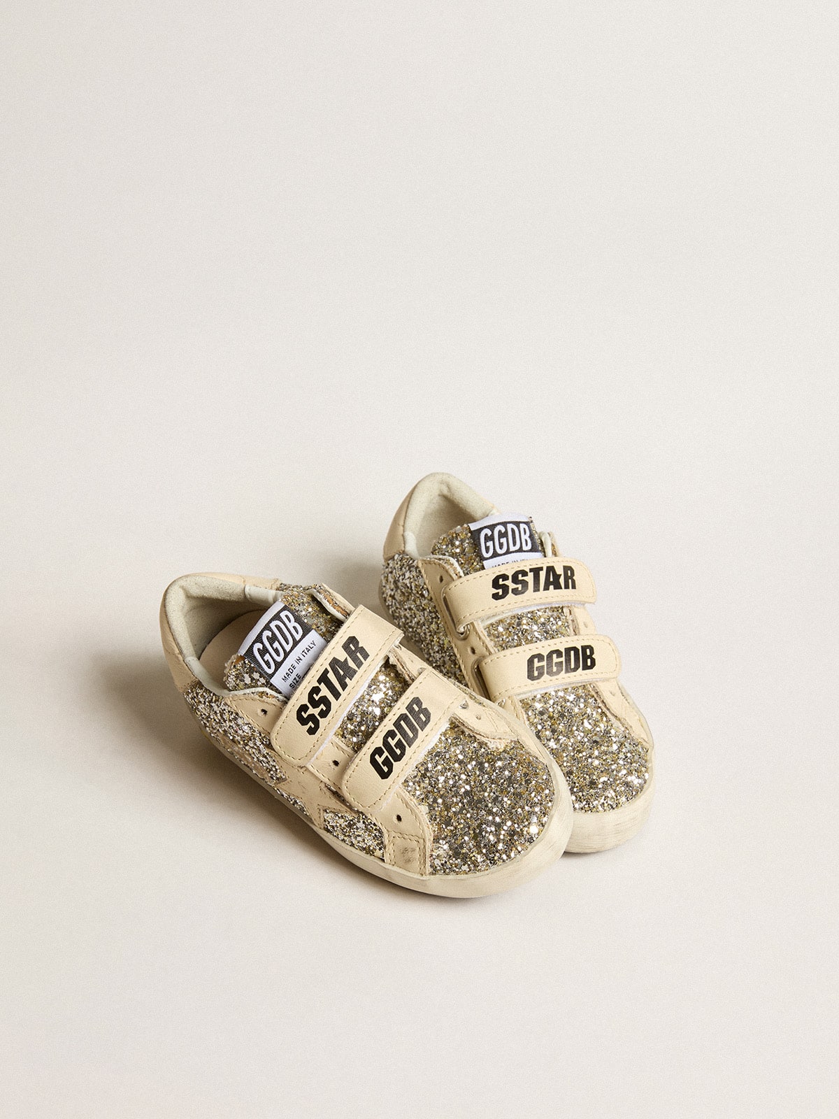 Young Old School in platinum glitter with leather star and heel tab