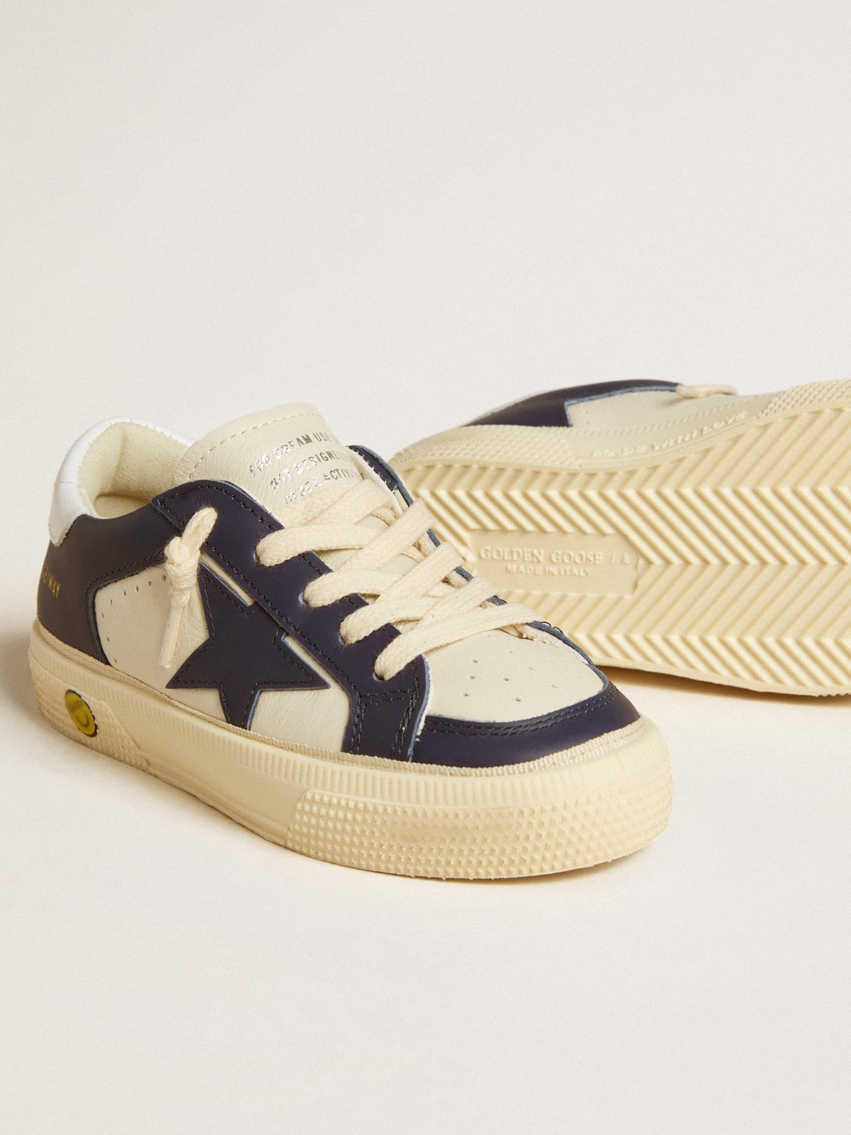 Young May in white and blue leather with leather star and heel tab